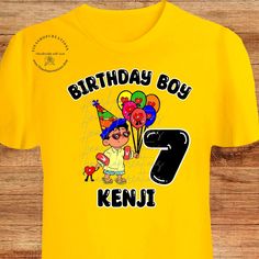 Get ready to celebrate in style with our Bad Bunny Birthday shirts! Inspired by his hit album Un Verano Sin Ti, these shirts are perfect for kids and adults alike. Featuring a cute design of Baby Benito holding birthday balloons, these shirts are sure to stand out at any birthday party. And for an extra special touch, personalize it with the birthday kid's name and age. Want to make it a family affair? We've got you covered with matching shirts for the whole family. Get your bunny on and make a Casual Yellow T-shirt, Fun Graphic Print T-shirt For Birthday, Fun Yellow Top For Birthday, Playful Birthday Shirt With Funny Print, Playful Shirt With Funny Print For Birthday, Novelty Cartoon Print T-shirt For Birthday, Pop Culture Cotton T-shirt For Birthday, Yellow Letter Print T-shirt For Birthday, Playful Cartoon Print Shirt For Birthday