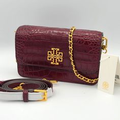 Nwt Auth Tory Burch Britten Croc Convertible Crossbody Shoulder Bag In Claret Croc Embossed Leather Gold-Tone Logo Plaque Color: Claret/639 Snap Closure Adjustable, Removable Leather And Metal Chain Shoulder Strap May Be Carried As Shoulder Bag Or Crossbody Interior Zip Pocket 8l X 2.5"W X 5" H Style Number 86063 No Dust Bag Included Tory Burch Crocodile Bag, Tory Burch Crossbody Handbags, Leather Crossbody Bag Tory Burch, Tory Burch Britten, Tory Burch Bag, H Style, Metal Chain, Crossbody Shoulder Bag, Embossed Leather