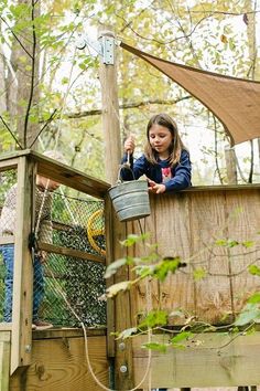 two children are playing in the tree house