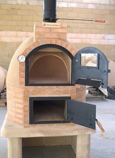 an outdoor brick pizza oven in a garage