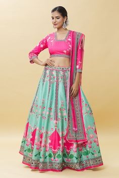 Pink and sea green attached cancan raw silk lehenga with all over lotus bloom art print and mirror work detail. Paired with a floral jaal printed blouse and border print embellished georgette dupatta. - Aza Fashions Fitted Green Lehenga With Motifs, Green Lehenga With Motifs For Reception, Green Wedding Sets With Motifs, Fitted Pink Lehenga With Meenakari Detailing, Green Wedding Lehenga With Motifs, Pink Fitted Sharara With Meenakari Details, Green Silk Sets With Motifs, Mirror Work Lehenga, Raw Silk Lehenga