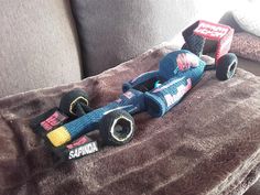 a toy car sitting on top of a couch