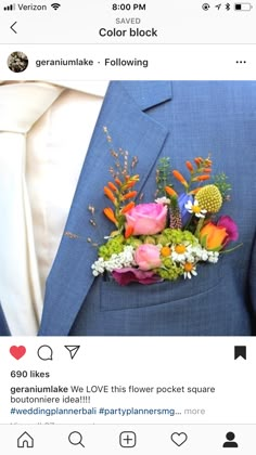 a man in a blue suit with flowers on his lapel flower bouquet is shown