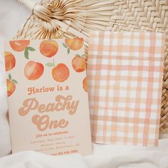 an orange themed birthday party with peaches and gingham paper on the table