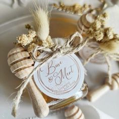 a jar filled with honey sitting on top of a white plate