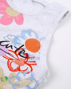 Details: Sleeveless tank top with Such Cute floral graphical printTop Length: CroppedSleeve Length: SleevelessMaterials:95% Cotton + 5% Spandex