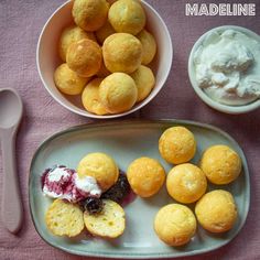 there are several different types of food on the table with utensils and spoons