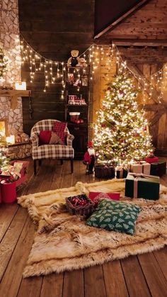 a room with christmas trees, presents and lights on the floor in front of a fireplace