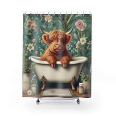 a shower curtain with a painting of a brown cow in a bathtub surrounded by flowers