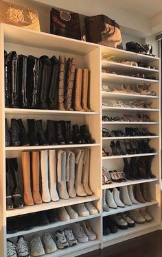 a closet filled with lots of shoes and bags