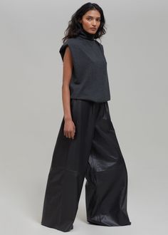 Color: Black Midweight smooth leather Relaxed fit Wide leg Elasticated waistband Side seam hip pockets Slip-on style Unlined 100% Lamb Skin Dry Clean By The Frankie Shop. Made in India Style Wide Leg Pants, Mini Pleated Skirt, Long Pencil Skirt, Leather Pants Outfit, Wool Pencil Skirt, Pleated Long Skirt, Sleeveless Turtleneck, Leather Pencil Skirt, Twill Shirt