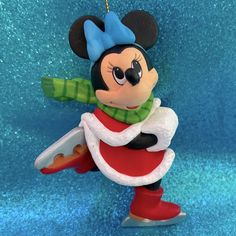 a mickey mouse ornament hanging on a wall