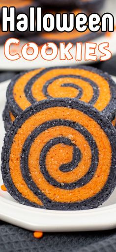 three halloween pinwheel cookies on a white plate