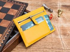 Welcome to the shop. The product is 100% Genuine Leather. The color of the product is yellow. Handmade wallet is made of premium quality genuine leather. 10 credit card pockets 1 coin pocket 1 pocket of paper money Extremely lightweight. Will be more smooth and shiny as time passes by Handmade Yellow Wallet For Daily Use, Handmade Yellow Wallets For Daily Use, Yellow Coin Purse With Card Slots As Gift, Yellow Card Holder With Card Slots As Gift, Yellow Rectangular Wallet With Rfid Blocking, Yellow Wallets With Card Slots For Daily Use, Yellow Wallets With Rfid Blocking For Daily Use, Yellow Rectangular Card Holder Gift, Yellow Wallet