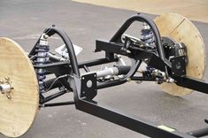 the front end of a vehicle with wheels attached to it