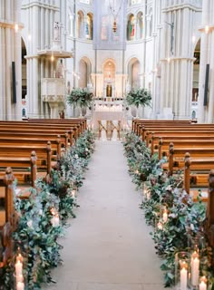 the aisle is decorated with greenery and candles for an outdoor wedding ceremony at st patrick's cathedral