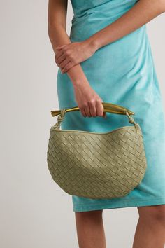 Bottega Veneta's 'Sardine' tote builds on the brand's house codes. Made in Italy from supple leather using the intrecciato weave, this small design is enhanced with a sculptural gold-tone handle. Match it to your jewelry. Luxury Handheld Hobo Bag With Leather Handles, Designer Shoulder Bag With Rolled Handles, Designer Hobo Bag With Round Handle, Luxury Green Bag With Rolled Handles, Luxury Green Bags With Rolled Handles, Designer Hobo Bag With Leather Handles For Office, Designer Office Hobo Bag With Leather Handles, Evening Leather Hobo Bag With Rolled Handles, Luxury Formal Hobo Bag With Braided Handles