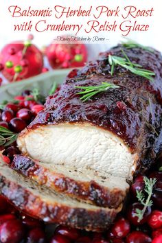 baked pork roast with cranberry, fresh garnish glaze on a platter