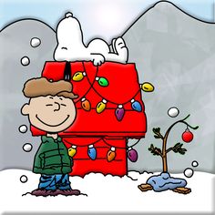 a charlie brown christmas card with snoopy on the top of a red suitcase in the snow