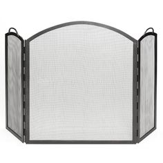 an iron fireplace screen with mesh panels