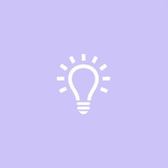 a white light bulb on a purple background