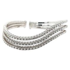 Sparkling 18Kt White Gold Wave Bracelet Clamper / Bangle 3.01ct Diamonds Elegant and tasteful diamond bracelet with beautiful brilliant cut/clarity/color diamonds. Diamonds: 120 diamonds together 2.83 carat Material: 18kt white gold Total weight: 34.3 gram / 1.215 oz / 22.1 dwt Measurements: 59.2 x 51.1 x 9.6 mm Can fit a wrist from 16 - 18 cm (we can make it bigger on request ) Wave Bracelet, Gold Waves, Stone Design, Gold Pearl, Silver Heart, Colored Diamonds, Diamond Bracelet, Stone Color, Bangle Bracelets