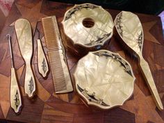 Here we have a relic from the flapper era, a Jadite green dresser set for the lady's vanity ! Also included are a matching comb & brush, button hook, shoe horn, and manicure accessory. A total of 9 pieces, 100 years old, all in gorgeous condition ! Black decoration on each piece is incised. All pieces appear to have never been used. Jadite Green, Green Dresser, Flapper Era, Girl Braids, Vanity Decor, Shoe Horn, Vintage Suits