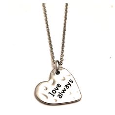 This 'Silvertone Hammered Pattern Heart Shaped Love Always Necklace' Is 18 Inches Long With A 3/4 Inch Pendant. This Item Is Perfect For Yourself Or For Gift Giving. (Jlu9910) (Oggnec) (Oggval) Silver Hand Stamped Heart Necklace For Anniversary, Silver Stamped Charm Necklaces For Valentine's Day, Silver Stamped Charm Necklace For Valentine's Day, Silver Heart Necklace With Hand Stamped Details, Valentine's Day Silver Stamped Charm Necklaces, Silver Nickel-free Charm Necklace For Valentine's Day, Silver Adjustable Heart Necklace For Valentine's Day, Valentine's Day Nickel-free Silver Charm Necklace, Love Always