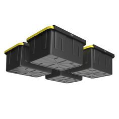 three black plastic storage containers with yellow lids on each side and one in the middle