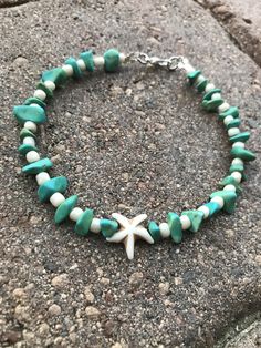 This pretty boho style beach Anklet is made with turquoise green howlite chips, cream glass beads, and a white howlite starfish charm. Ankle bracelet comes in several sizes, just choose your size from the drop down menu at checkout. Starfish Anklets, Beaded Ankle Bracelets, Beaded Ankle, Edgy Jewelry, Beaded Anklet, Trending Bracelets, Anklets Boho, Beach Anklets, Seashell Jewelry