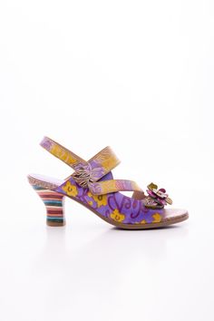 Walk on the wild side with this midnight sol floral leather slingback sandal! Slip into a sassy summer look that's as stylish as it is comfy. It's a no-brainer for any fashionista looking for a chic way to make a statement. Make 'em say "soffia!" 2.16" heel Hook & velcro closure Genuine leather upper Leather footbed Leather lining Leather midsole Rubber sole Spring Floral Print Leather Heels, Multicolor Slingback Sandals For Summer, Multicolor Slingback Heels For Summer, Multicolor Slingback Heels For Spring, Multicolor Leather Summer Heels, Summer Multicolor Leather Heels, Vacation Leather Slingback Heels, Leather Slingback Heels For Vacation, Leather Sandals With Floral Print And Round Toe