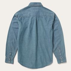 This snap-front western shirt is crafted from 100% cotton chambray denim that’s been garment washed for a lived-in feel, and made to get softer and more comfortable with time. It has one open pocket, no front yoke, a straight back yoke with pleat, one-snap cuffs and contrast cream topstitch. Cut trim for a modern fit, the shirt is finished with logo pearl snaps and subtle Stetson embroidery that speaks to our commitment to quality. Hard-wearing and built to last, our denim shirts are defined by Classic Pre-washed Denim Tops, Classic Denim Tops Pre-washed, Dark Wash Chambray Button-up Denim Top, Classic Medium Wash Chambray Denim Top, Washed Blue Chambray Denim Top With Button Closure, Dark Wash Cotton Tops For Rodeo, Western Style Denim Blue Shirt For Rodeo, Indigo Chambray Button-up Denim Top, Medium Wash Chambray Collared Shirt