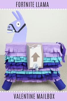 an origami llama made out of purple and blue paper