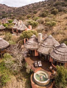 an aerial view of some huts and a hot tub