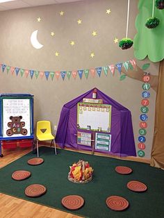 a child's playroom with toys and decorations on the walls, including teddy bears