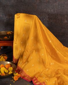 "Experience the vibrant beauty of our Handwoven Narali Kath yellow pure silk yeola paithani. Handcrafted with traditional weaving techniques, each piece is a unique work of art. Add a touch of elegance and tradition to your wardrobe (without breaking the bank!). No two are alike. Limited edition!" Yellow Saree For Transitional Season With Traditional Drape, Transitional Season Yellow Unstitched Saree, Festive Yellow Art Silk Traditional Wear, Festive Yellow Traditional Drape Wear, Unstitched Chanderi Traditional Wear With Tilla, Traditional Chanderi Wear With Tilla For Puja, Traditional Katan Silk Wear With Tilla, Traditional Drape Katan Silk Wear With Tilla, Raw Silk Tilla Saree For Traditional Ceremonies