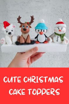 a hand holding up a cake topper with christmas decorations on it and the words cutie christmas cake toppers