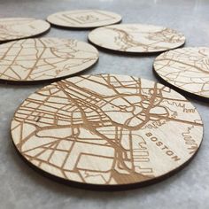 six wooden coasters with the names and map of london on them, all made out of wood