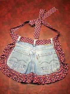 an old pair of jean shorts with a bow tied around the waist and tie at the back