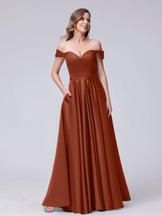 a woman wearing an off the shoulder bridesmaid dress