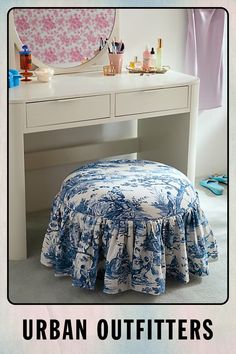 an image of a blue and white bed in front of a mirror with the words urban outfitters on it