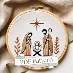 a cross stitch nativity scene with the birth of jesus