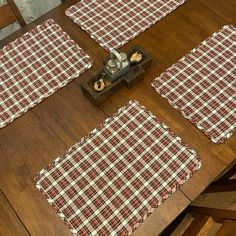 four placemats on a wooden table with food