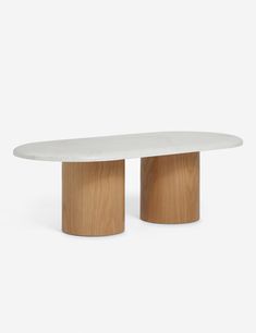 two white marble tables with wooden bases