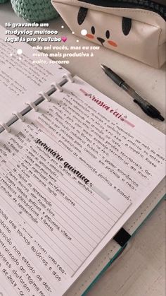 an open notebook sitting on top of a table