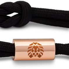 Black small Knotaclat bracelet featuring rose gold electroplated hardware and contrast emblems. -100% Polyester-One size fits most wrists, 4.5" to 6" wrist circumference 1% of net proceeds from all Rastaclat sales are donated to the Seek The Positive Foundation. Modern Adjustable Rose Gold Bracelets, Adjustable Rose Gold Friendship Bracelet With Sliding Knot, Adjustable Rose Gold Bracelets With Cord, Adjustable Rose Gold Cord Bracelet, Adjustable Rose Gold Braided Bracelet, Adjustable Rose Gold Bracelets, Knotted Bracelet, Bracelet Knots, Wrist Game