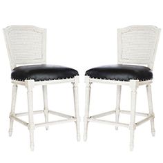 a pair of white chairs with black leather seat cushions on each side and backrests