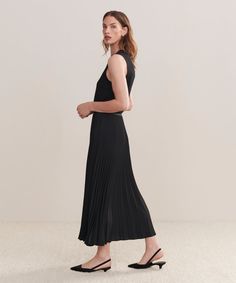 Pleated Skirt Black Dressed up or down with ease, this pleated matte skirt is perfect for any occasion. With an easy, ultra-flattering drape, this piece is meant for styling with varied silhouettes: pair it with a relaxed knit or turtleneck for an elevated look or a slim-fit tee for more casual styling. Spring Midi Dress With Accordion Pleats, Chic Solid Color Pleated Dress, Chic Pleated Dress With Pleated Waist, Solid Chic Pleated Skirt, Chic Pleated Skirt With Folds, Chic Pleated Dress With Solid Color, Chic Stretch Long Pleated Skirt, Chic Long Stretch Pleated Skirt, Chic Flowy Maxi Skirt With Folds