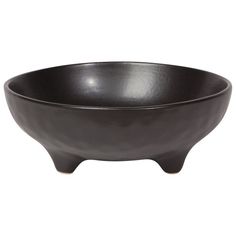 a black bowl sitting on top of a white table