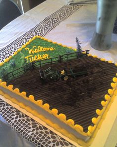 a sheet cake with a farm scene on it and the words welcome to indiana written in frosting